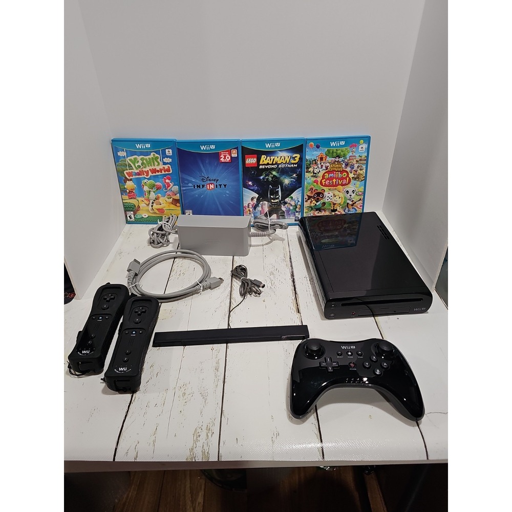 WII U console only - 4 GAMES - 3 controllers